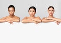 Three Multiethnic Ladies Standing Posing Behind White Board In Studio