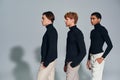 three multiethnic men in black turtlenecks