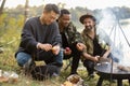 Multiracial friends having a picnic on fishing