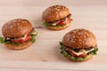 Three mushroom burgers on wooden background