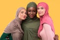 Three Muslim Women In Hijab Headscarf Embracing Posing In Studio Royalty Free Stock Photo