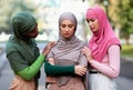 Three Muticultural Muslim Women Supporting Depressed Friend Outdoors Royalty Free Stock Photo
