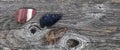 Three Native American arrowheads on rustic wood