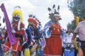 Three Native Americans in full costume performing