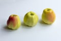 Three natural organic apples on a white background Royalty Free Stock Photo