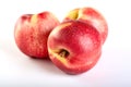 Three Nectarines fruit isolated on white Royalty Free Stock Photo