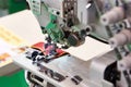 Three needle five threaded industrial sewing machine of flat bed