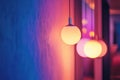 Three neon light bulbs hanging from the ceiling, each with a different color Royalty Free Stock Photo