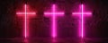 Three neon pink crosses on a brick wall, glowing light effect, modern art concept Royalty Free Stock Photo