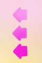 Three Neon Pink Paper Arrows on Paper Yellow Background Concept Vertical Toned