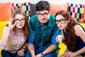 Three nerds on the couch Royalty Free Stock Photo