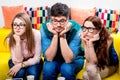 Three nerds on the couch Royalty Free Stock Photo
