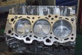 Three new pistons are installed in the engine cylinder block