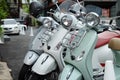 Three new Vespa motorcycles parked Royalty Free Stock Photo