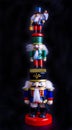 Three nutcracker toys standing on each other Royalty Free Stock Photo