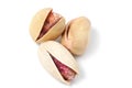 Three nuts pistachios with salt close-up on a white background, isolate
