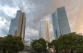 Three office buildings Deuthce Bahn in the middle are standing under a cloudy sky Royalty Free Stock Photo