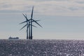 Three offshore wind farm wind turbines abstract pattern silhouette Royalty Free Stock Photo