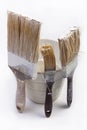 Three old brushes used and a jar. On white backgorund Royalty Free Stock Photo