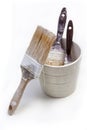 Three old brushes used and a jar on white background Royalty Free Stock Photo