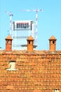 Three old chimney pot with modern construction in the background Royalty Free Stock Photo
