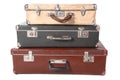 Three old dirty dusty suitcases.