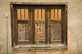 Three old doors, brown with windows, Jackson, Wyoming. Royalty Free Stock Photo