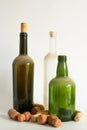 Three Old dust wine bottle and corks on white Royalty Free Stock Photo