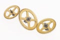 Three old golden cogwheels