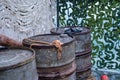 Three old industrial oil barrels. A large iron container for diesel fuel or gasoline on a military ship in the army Royalty Free Stock Photo