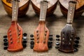 Three old mandolins rotated fingerboards to the camera. Royalty Free Stock Photo