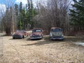 Three old rusted cars decor in the yard Royalty Free Stock Photo