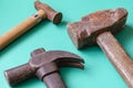 Three old rusty hammers on a colored background Royalty Free Stock Photo