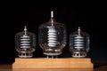 Three old vacuum transmitting tubes black background Royalty Free Stock Photo