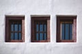 Three old vintage windows on white wall Royalty Free Stock Photo