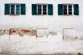 Three old windows on old white wall as background Royalty Free Stock Photo