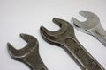 Three old working wrenches on a white background. Work Tool mechanic. Close up Royalty Free Stock Photo