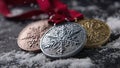 Three Olympic medals laying on the snow. Generative AI Royalty Free Stock Photo