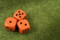 Three orange dice togheter Royalty Free Stock Photo