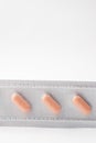 Three orange pills in blister Royalty Free Stock Photo