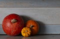 Three orange, red and yellow pumpkins