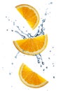 Three orange slices flying in splashing water  isolated Royalty Free Stock Photo