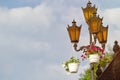 Three orange street lights on the sky background Royalty Free Stock Photo