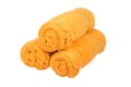 Three orange towels rolls