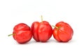 Three organic acerola cherries Royalty Free Stock Photo