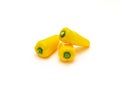 Three organic yellow mini sweet peppers snack isolate on white Royalty Free Stock Photo