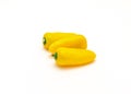Three organic yellow mini sweet peppers snack isolate on white Royalty Free Stock Photo