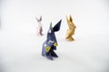 Three Origami rabbits on white background