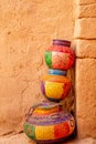 Three ornated traditional decorated arabic jars standing on each other on street of Al Ula, Medina province