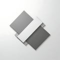 Three overlapping sheets of paper in shades of gray and white on a light background Royalty Free Stock Photo